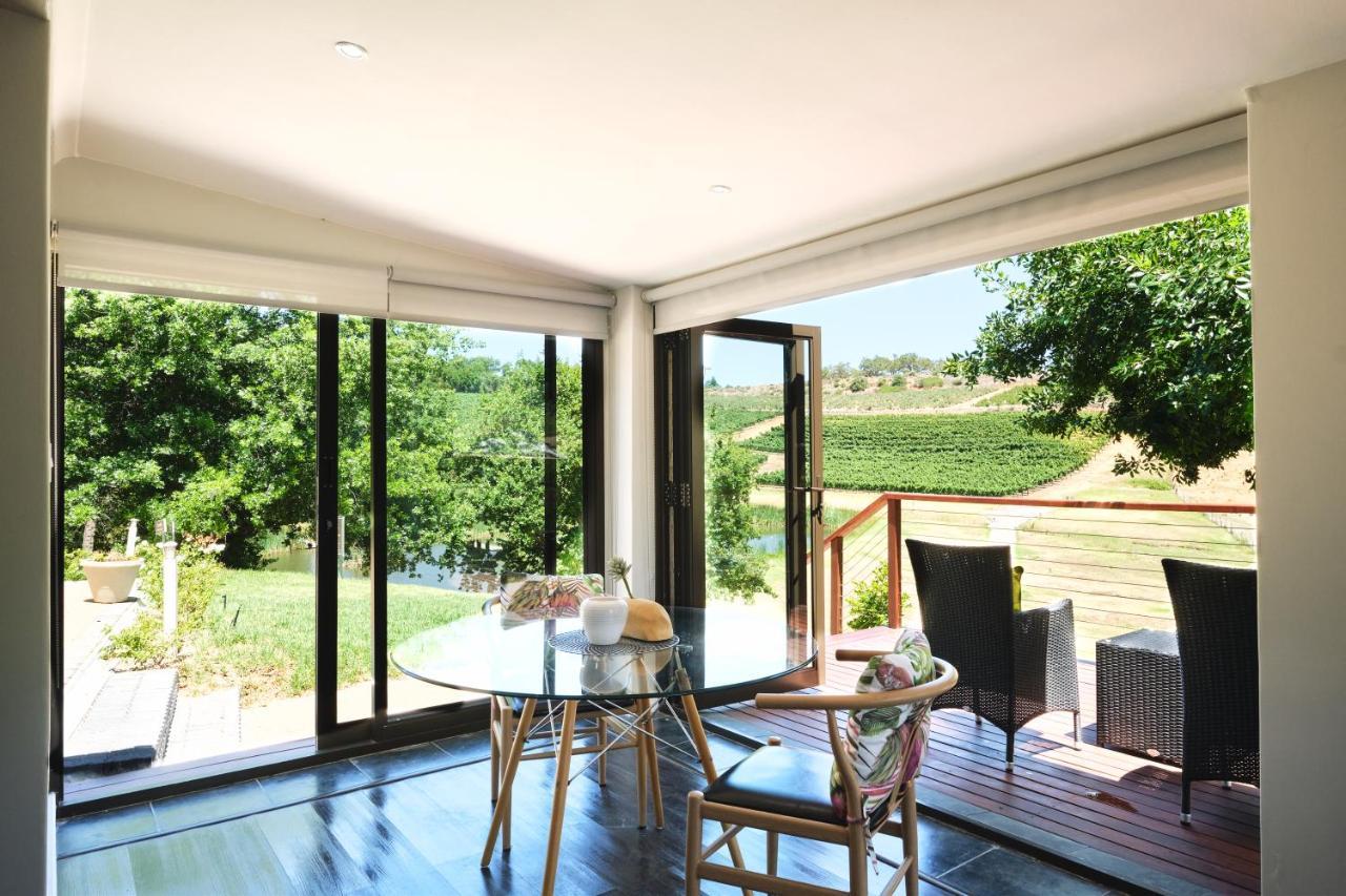 Alluvia Boutique Winery & Luxury Accommodation Stellenbosch Kültér fotó A room with a view of the vineyards