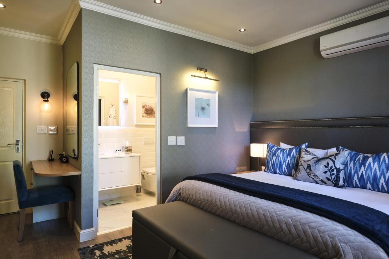 Alluvia Boutique Winery & Luxury Accommodation Stellenbosch Kültér fotó A bedroom at the Oyster Box